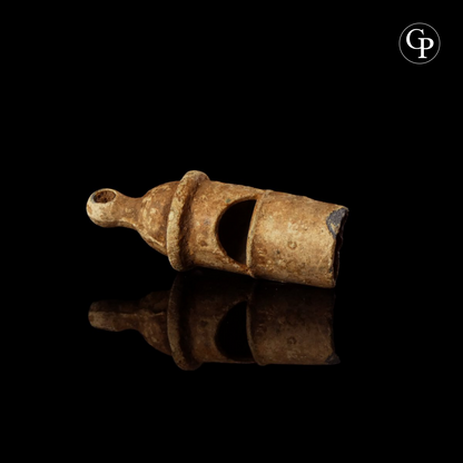 Ancient Roman lead whistle (sifflet en plomb) from a legionary, 1st-3rd century AD. Rare military artifact with characteristic cylindrical body and mouthpiece. | Sifflet en plomb romain antique, légionnaire, Ier-IIIe siècle apr. J.-C. Rare artefact militaire à corps cylindrique et embouchure caractéristique.